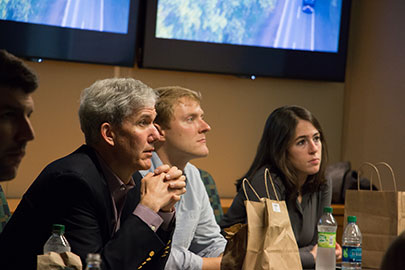Dean Matthew J. Slaughter and MBA students listen to community talk