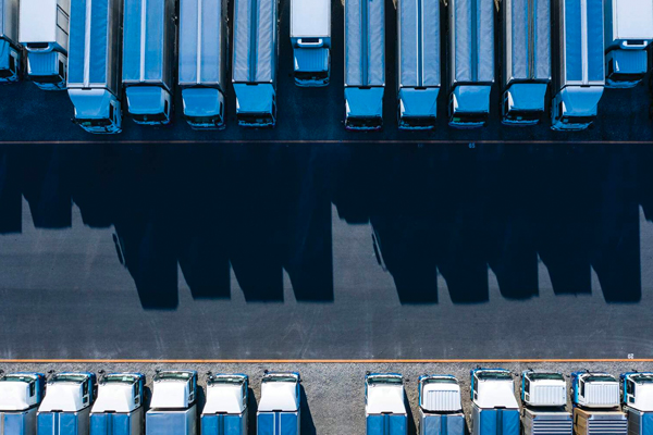 Lines of parked shipping trucks.