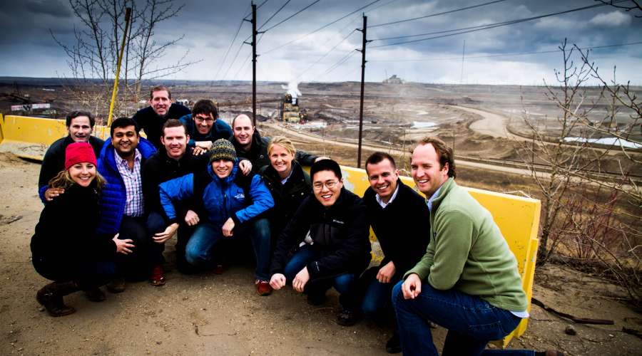 Oil_Sands_Tuck_group_with_the_Syncrude_North_Mine_in_the_background.jpg
