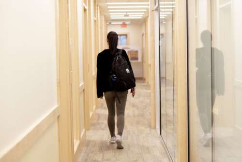 Student walking down a hall