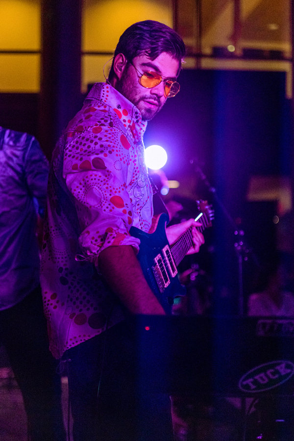 Calvin Garay playing guitar at a show